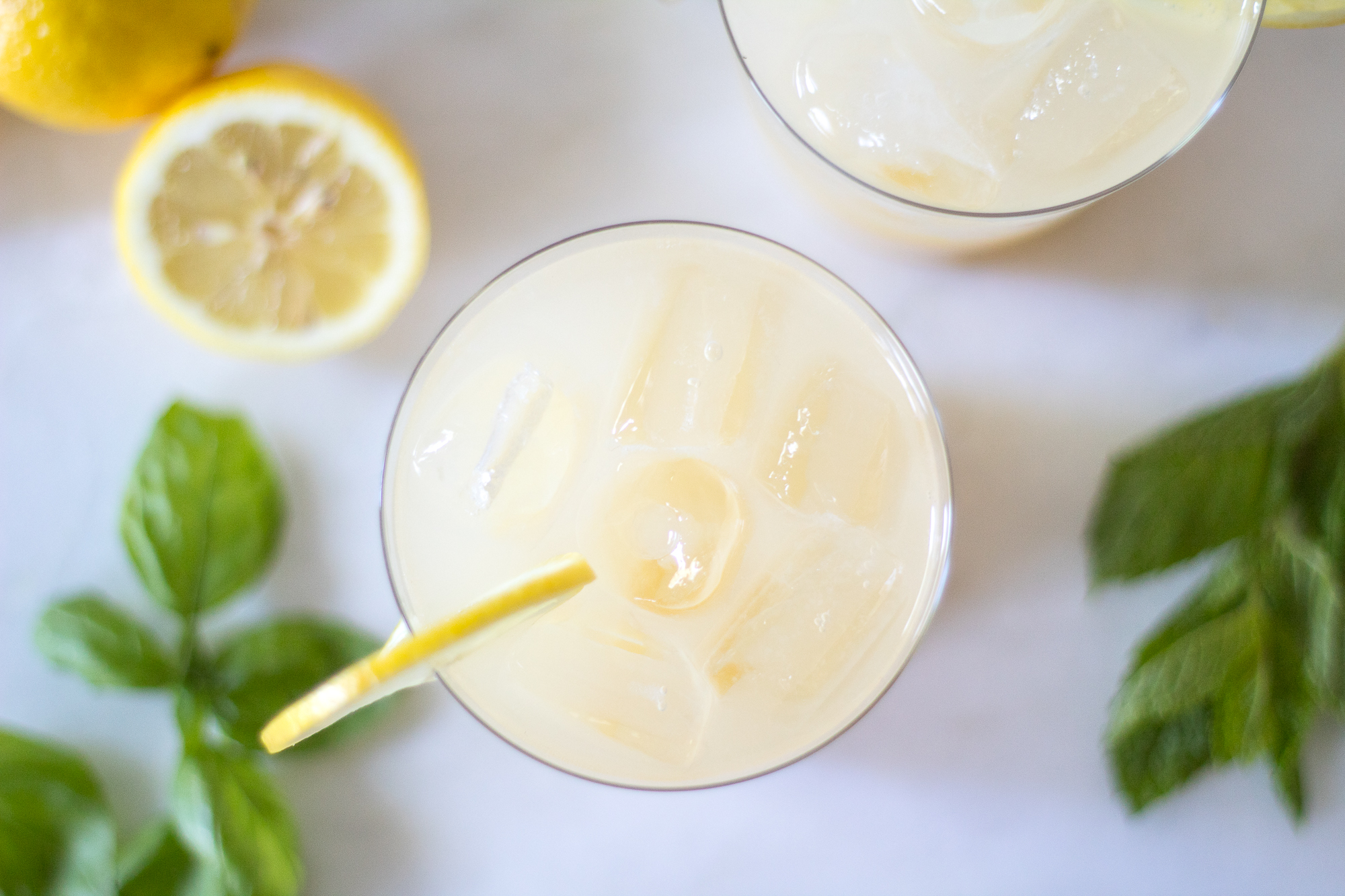 sparkling whiskey lemonade with basil and mint